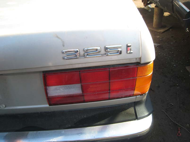 Illustration for article titled Junked BMW E30s Provide Cheap, Easy Way To Trunk-Mount Your Battery